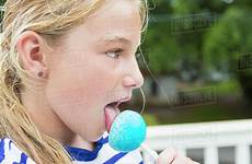 licking tongue girl blue lollipop caucasian stock dissolve blend d145
