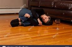 passed woman floor lying wine young drunk fetal position glass stock bed alamy laying shutterstock
