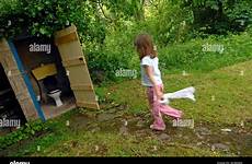toilet girl outside outdoor using stock outhouse alamy public baby dwf score credit people