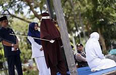 caned caning aceh cane punishment publicly terrified brutally cops sharia ragazzi mentre sesso fanno sorpresi punishable carried