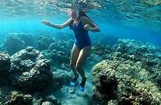 underwater girl snorkeling reef coral swimming woman sea beach water young tropical video background stock bright clear above footage