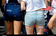 shorts wearing girls young women alamy stock