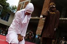 woman indonesian public she sex women having whipped caned outside marriage indonesia sharia man passes child till young law her