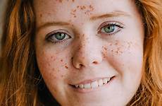 girl freckles close ginger hair lip biting her teenage