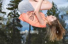 trampoline girl jumping down young alamy teenage upside action stock freeze model release