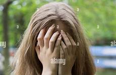 hands woman hiding outdoors face young stock alamy embarrassed