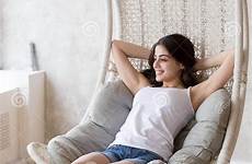 chair sitting woman relaxing lounge smiling young barefoot hanging stock dreamstime