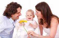 daughter child mother father parents girl family woman baby couple people man portrait young smiling together person play happy photography