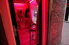 red light district amsterdam curtains window prostitute amsterdams