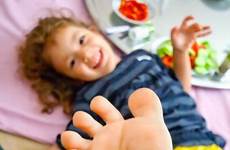 girl little footsie playing feet stock child alamy depositphotos feets