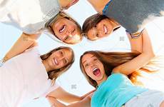 group teenage four girls fun having friends laughing together huddle friendship outdoors smiling bigstock