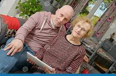 adult son mother her tablet looking digital sofa mature technology