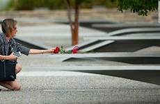 memorial pentagon woman faces reaches where they now attacks 13th anniversary terror cnn benches frames photographs around week touch attack