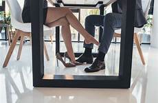 man woman seducing table under flirting touching stock leg foot her royalty cropped flirtatiously suit shot