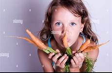 eating girl carrots stock alamy fresh child sweet young