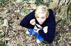 miley cyrus pees peeing tree hears wild call posts choose board woods squats