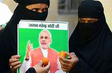 modi muslim muslims hindu indian women india narendra bjp party victory janata bharatiya portrait candidate sweets ministerial victorious hold prime