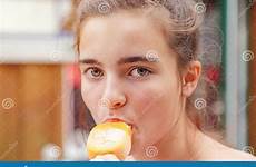 popsicle eating girl teenage stock portrait