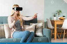 vr reality virtual sitting headset wearing glasses woman attractive couch goggles preview