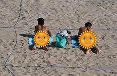 sunbathers fined violating fled apparently