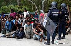 migrants spanish storm europe african ceuta sweden police muslim border africa fence spain refugees violent officers who storming radicalism gates