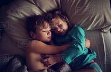 sleeping siblings bed overhead dissolve d1061