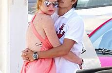 greece lohan tarabasov egor lindsay kisses continue vacation their two airport fiancé mykonos tactile waiting tuesday put display while jet