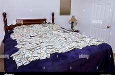 bed money covered piles alamy american