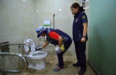 bathroom korea camera women south police seoul spy officer toilet asia world volunteer inspecting than will