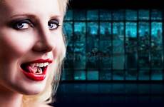 licking her teeth attractive vampire night stock