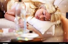 asleep drunk drinking woman sofa young after stock alamy down