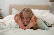 girl bed lying feet between portrait stock dissolve d25