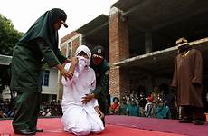 woman public sex caned indonesian having punishment young muslim whipped outside marriage whipping being stage her aceh man she knees