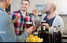 drinking beer guys smiling three laughing party house stock alamy