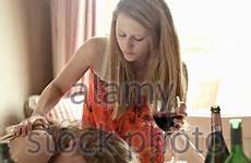 drunk teenage girl alamy girls stock bottles glasses wine table
