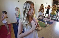 yoga girl instructor youngest devoe teacher years spa teaches san class classes female her yogis masslive encinitas diego local students