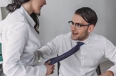 businesswoman touching seducing colleague