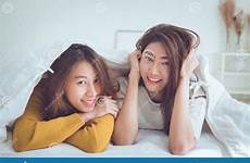 lesbian couple together wake concept young women happiness lying moment lovely blanket under asian after