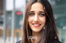 olive skinned woman beautiful light colored standing eyes young stock outdoors setting urban alamy