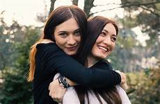 sister sisters sibling find adult siblings relationships track hugging outdoors smiling portrait young park grown shutterstock lost down