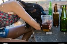 drunken woman sleeping table beer holding alamy glass