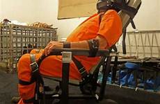 torture prison strapped beings