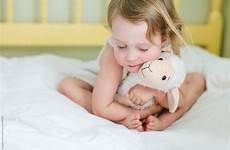 animal stuffed hugging girl little