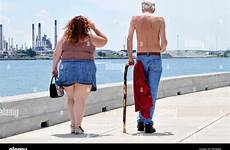 fat skinny man woman thin women walking chubby men overweight stock alamy very back