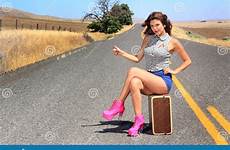 hiker hitch shorts short hiking heel boots high brunette pretty wearing suitcase her pink sexy beauty sitting heels road stock