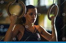 sporty fit athletics athletic sportswoman gymnastic gym rings working training sports using woman push health
