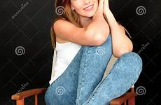 woman sitting chair beautiful young happy attractive hair relaxed feet preview