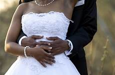 bride broom married wedding african women getting men weddings couple marriage american jump marry hands who holding church her there