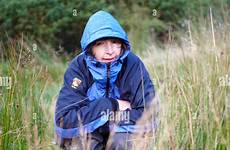 woman urinating squatting grass alamy stock wilds hiding scotland behind