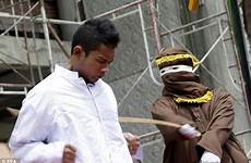 indonesia law aceh men gay punished caning sharia indonesian whipped women public sex being gays strict banda cane caned committing